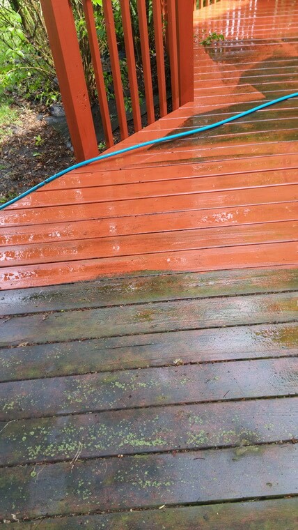 Photo of a red patio deck being soft washed and showing before and after