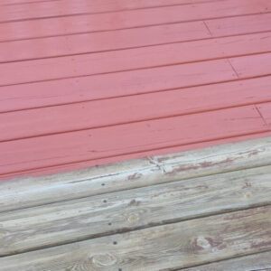 Photo of half of a red stained deck