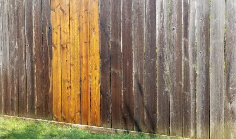 Photo of a partially cleaned fence to show comparison during a fence wash