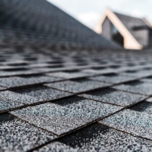 Closeup photo of clean roof shingles that are black