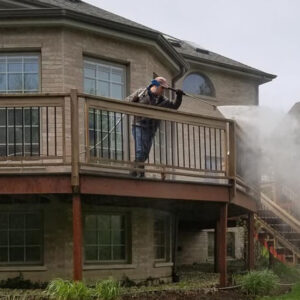 Photo of Powerhouse Pete soft washing a raised deck