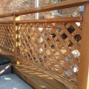 Photo of a wood deck railing that was cleaned and restored