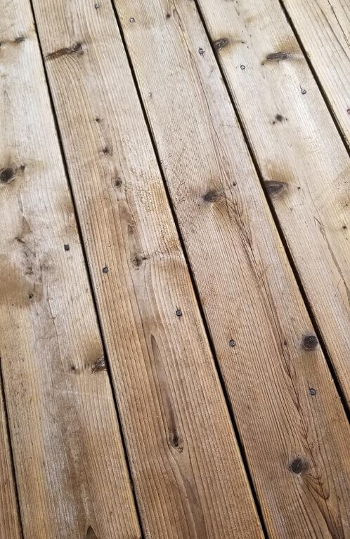 Closeup photo of cleaned wood deck boards