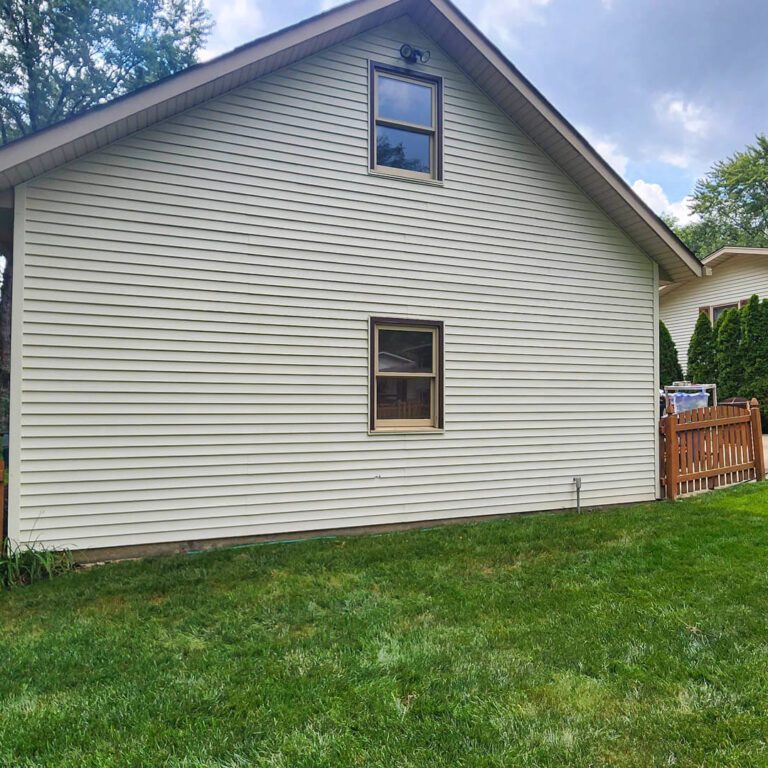 Photo of a residential house vinyl siding after being soft washed