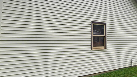 Photo of a residential house vinyl siding after being soft washed